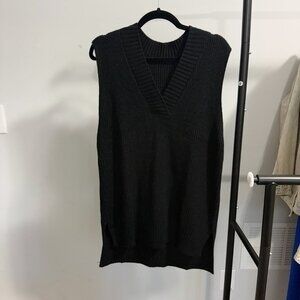 Black v neck sweater vest.